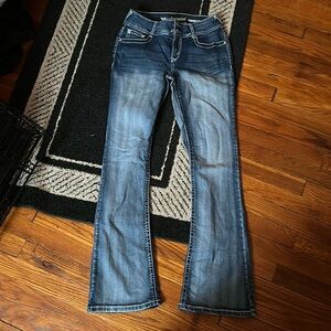 Bootcut distressed blue jeans